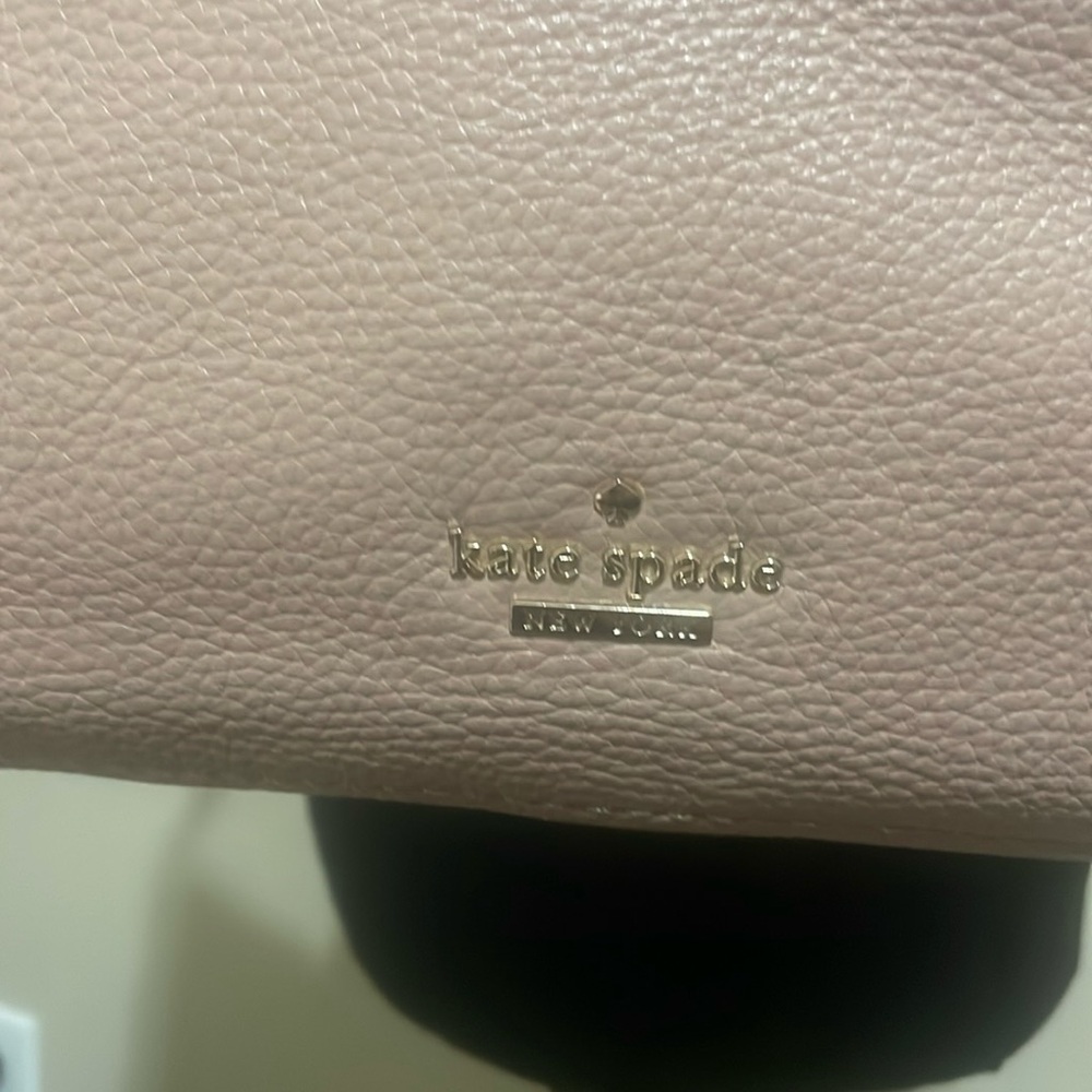 Pre-loved Kate Spade shoulder bag. Colors are fawn and black with gold accents. - Picture 1 of 9